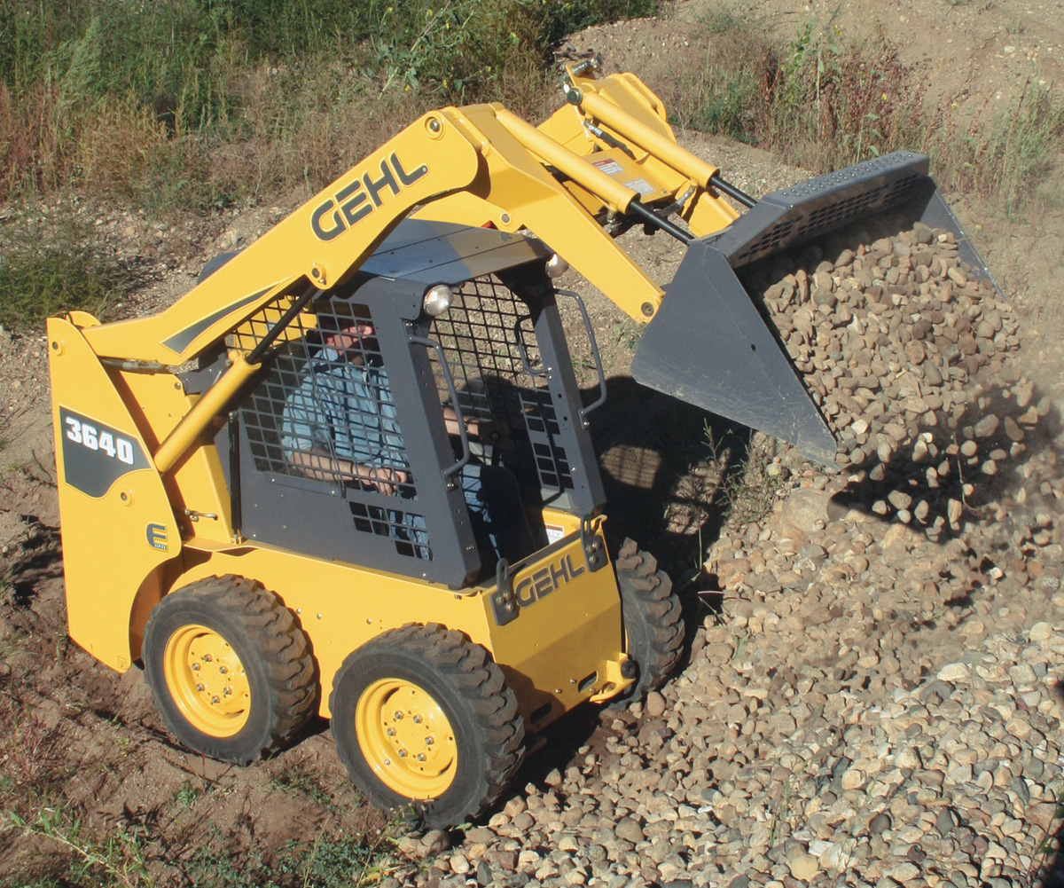 Skid Loader readying Asphalt Driveway Base Skid Loader readying Asphalt Driveway Base